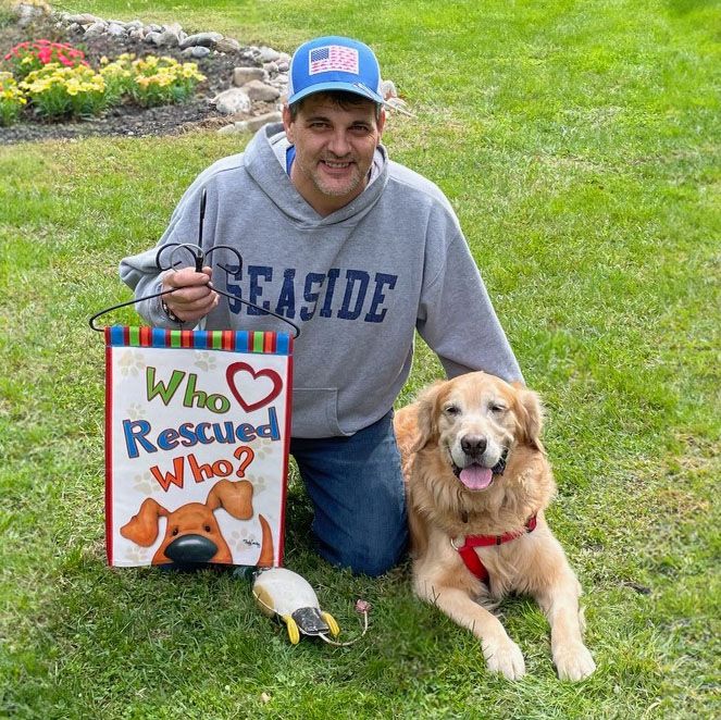 Man with his rescued Golden Retriever.